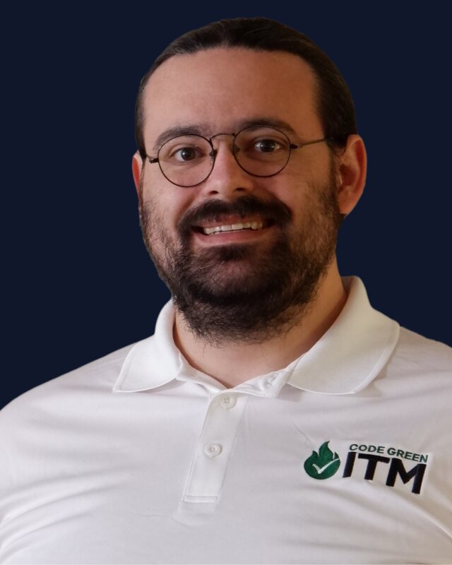 Justin Dohna in a white CodeGreen ITM polo